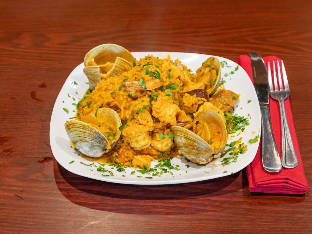 Paella · Shrimp, clams, chicken, sausage and rice.