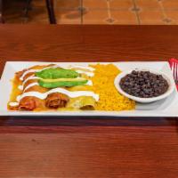 Enchilada Mixta · Chicken, beef and cheese enchilada served with guacamole, sour cream and 3 sauces, green, re...