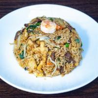 32. Spicy Basil Fried Rice · Hot. Soy sauce, Thai basil, chili, scallion, bean sprouts, egg, and onion.