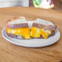 La Positivia · Scrambled eggs, cheddar, avocado, aji amarillo mayo. Add bacon, ham or merguez sausage for a...