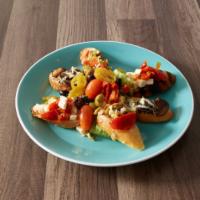 Grilled Italian Bread · Crostini misti. Grilled bread with assorted toppings, including roasted tomatoes, fresh mozz...