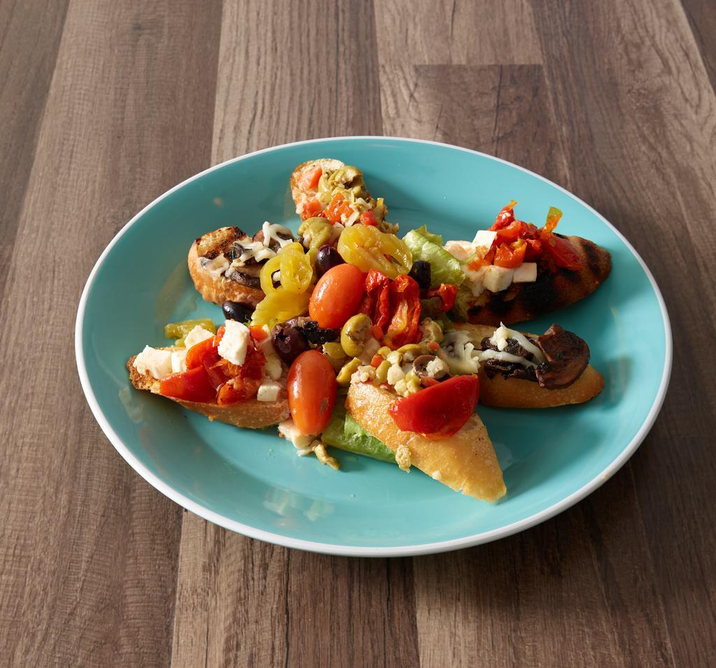 Grilled Italian Bread · Crostini misti. Grilled bread with assorted toppings, including roasted tomatoes, fresh mozzarella, Sicilian olive mix, mushrooms and fontina cheese.
