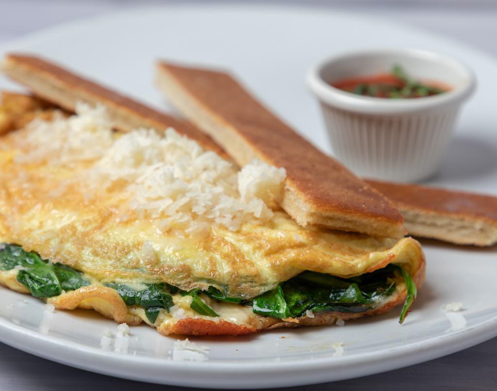Tortilla de Espinaca Con Manchego · Spinach omelette with manchego cheese and pressed Cuban toast.