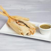 Tamal de Pollo y Rajas · Corn dough tamale stuffed with chicken and strips of jalapeno chiles, tomatillo avocado leaf...