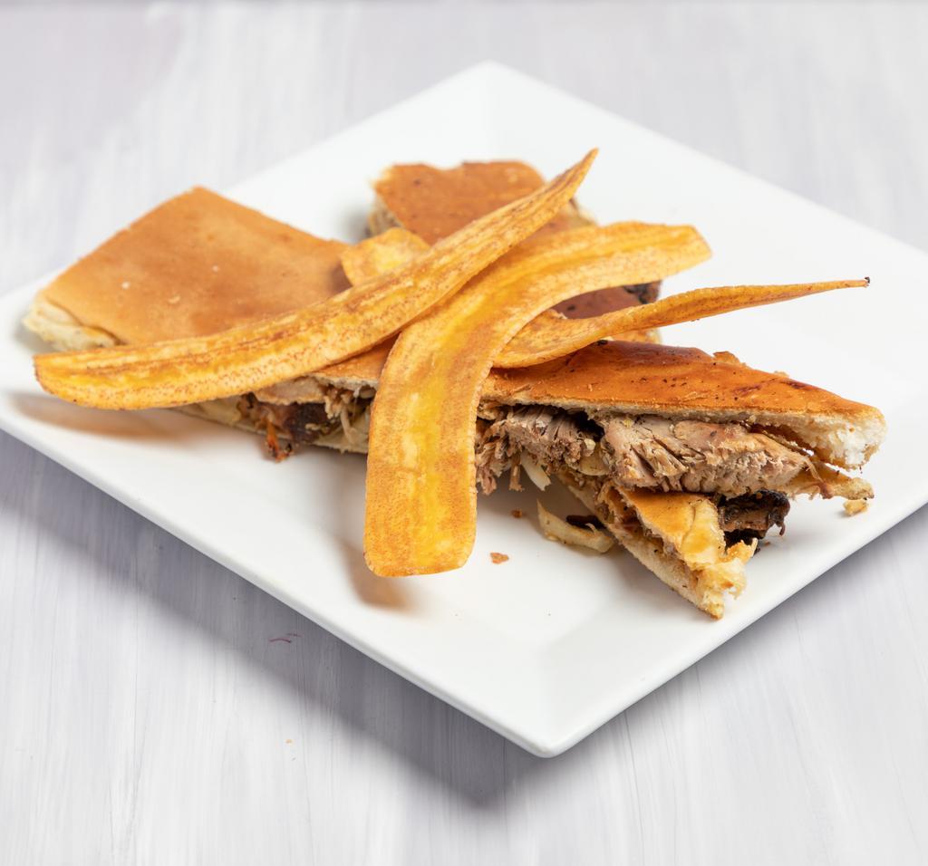 Pan con Lechon · Roasted pork, Cuban mojo and grilled onions.
