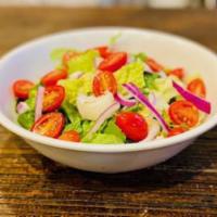 Garden Salad · Garden salad. Lettuce, tomato, onion and Italian dressing.