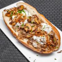 OG  Cheesesteak · shaved steak, American cheese, griddled onions and mushrooms, and herbs.
