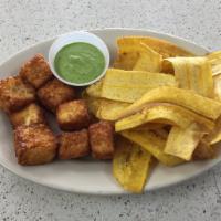 Fried Cheese · With fried green plantain and cilantro sauce.