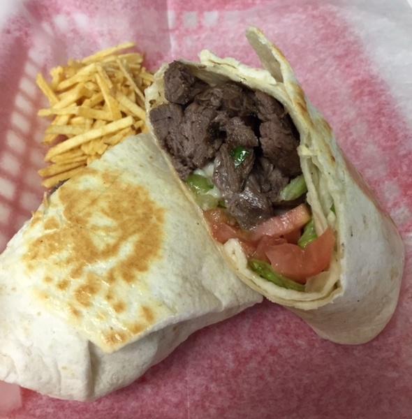 Sarussi Churrasco Wrap · Churrasco steak, mozzarella cheese, onions, tomatoes, potato sticks and house sauce.