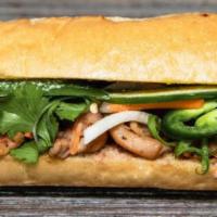 B2. Chicken Banh Mi · Served with pickled daikon and carrots, butter, pate, cucumber, cilantro, green onion, jalap...