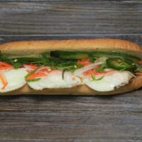 B6. Sunny Side Up Banh Mi · Served with pickled daikon and carrots, butter, pate, cucumber, cilantro, green onion, jalap...