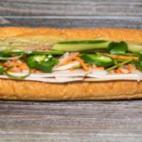 B8. Pork Roll Banh Mi · Served with pickled daikon and carrots, butter, pate, cucumber, cilantro, green onion, jalap...