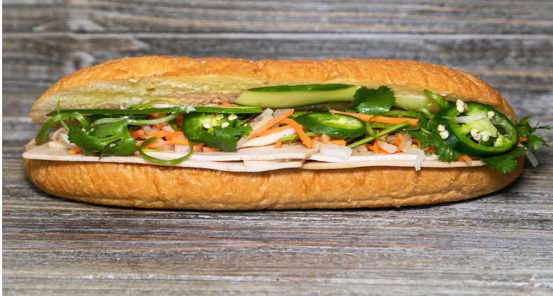 B8. Pork Roll Banh Mi · Served with pickled daikon and carrots, butter, pate, cucumber, cilantro, green onion, jalapenos, house sauce