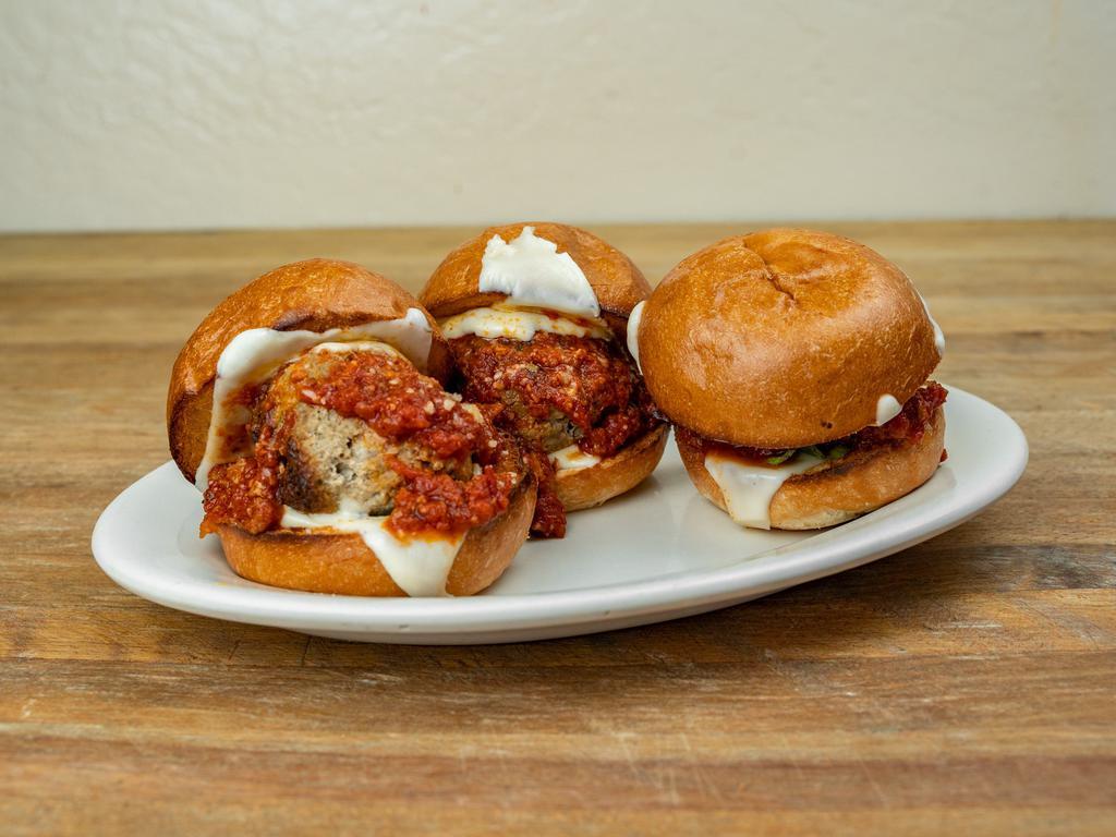 Meatball Sliders · Slider Roll with meatball, basil, sauce, and Parmesan cheese.
