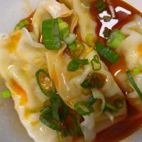 6 Chicken Dumplings in Hot Sauce · Steamed chicken dumpling, spice chili oil, onion