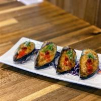 Motoyaki Mussels · Motoyaki topped baked mussels, scattered green onions and smelt roe, sriracha.