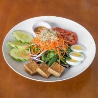 Thai Salad · Green Leaf lettuce, bean sprouts, eggs, red onions and fried tofu with peanut dressing.