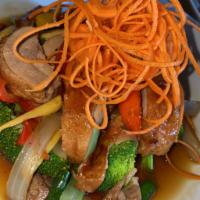 Basil Duck · Roasted boneless duck with bell peppers, onion and Thai chili basil sauce served over bok ch...