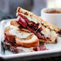 Smoked Corned Beef Reuben  · 14-hour smoked corned beef piled high on marbled rye, served with sauerkraut, 1000 Island dr...