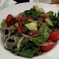 Baby Spinach Salad · Baby spinach, shaved Bermuda onion, avocados, Campari tomatoes, spiced pecans, chile-lemon d...