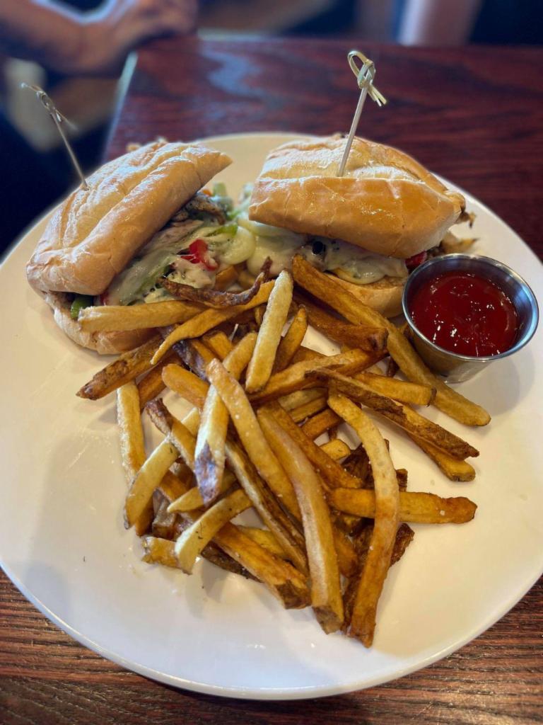 Chicken Philly · grilled boneless chicken breast topped with peppers, sweet onions, mushrooms and provolone cheese, served on a toasted hoagie with mayo, served with fries