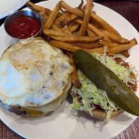 Royal Burger · grilled Angus burger topped with Canadian bacon, fried egg, shredded lettuce and tomato

