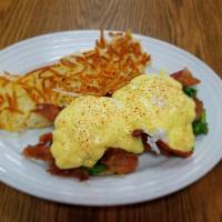 Florentine Benedict · Poached eggs over bacon, spinach, tomato and an English muffin topped with Hollandaise sauce.