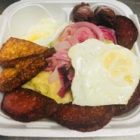 Mangu Breakfast · Mashed plantain with eggs, fried cheese and salami.