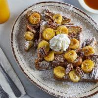 French Toast Supreme · Comes with fried bananas, pecans and whipped cream.