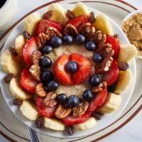 Hot Oatmeal Specialty · Oatmeal with raisins, bananas, blueberries, strawberries and nuts with brown sugar on the si...