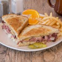 Reuben Sandwich  · On rye with fries and Swiss cheese, with choice of coleslaw, potato salad, french fries, cot...