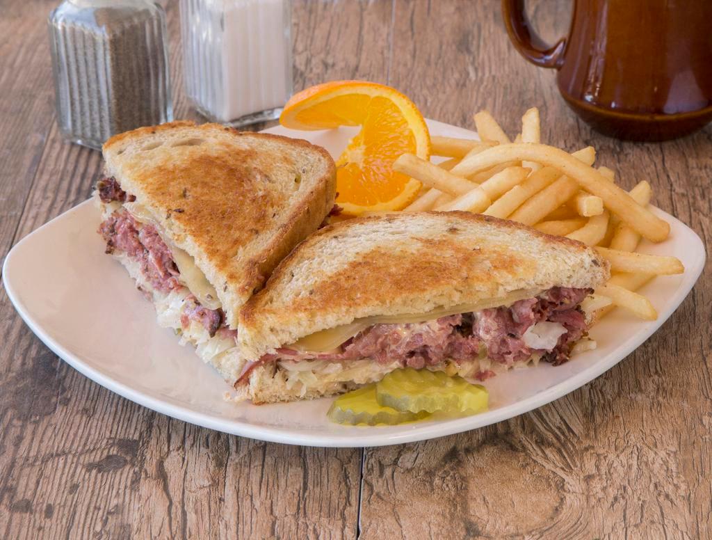 Reuben Sandwich  · On rye with fries and Swiss cheese, with choice of coleslaw, potato salad, french fries, cottage cheese, or fruit.