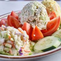 Stuffed Tomato with Tuna Salad Plate · Served with homemade potato salad, coleslaw, tomato and cucumber.