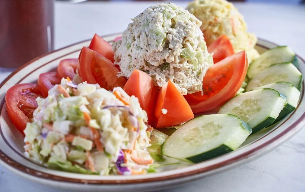 Stuffed Tomato with Tuna Salad Plate · Served with homemade potato salad, coleslaw, tomato and cucumber.
