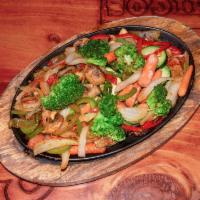 Fajitas Vegetarianas · Tomatoes, onions, bell peppers, carrots, zucchini, broccoli and mushrooms served with rice, ...