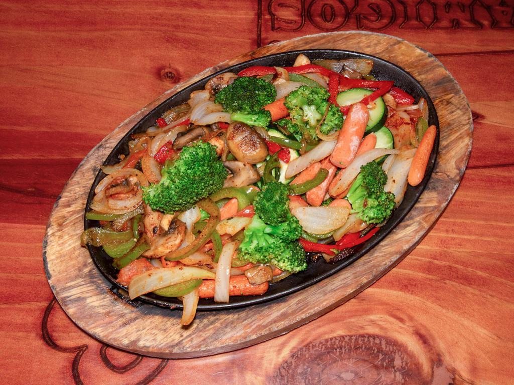 Fajitas Vegetarianas · Tomatoes, onions, bell peppers, carrots, zucchini, broccoli and mushrooms served with rice, beans and sour cream salad.