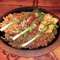 Parrillada Maya · Grilled chicken breast, carne asada, chorizo, shrimp, tilapia, calamari, scallops, scallions...