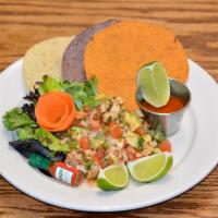 Ceviche · Cooked shrimp ceviche, avocado, tomatoes, onions, cilantro, with a side of tostadas and hot ...