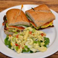 Grilled Veggie Sandwich · Hoagie bread with pesto spread, grilled bell peppers, carrots, tomatoes, cheese, basil, side...