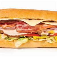 Turkey Bacon Club Sandwicheez · Turkey, ham, bacon, Swiss cheese, and the works: Lettuce, tomatoes, pickles, pepperoncini, r...