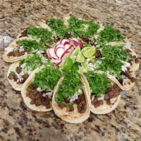 3 Tacos de Bistec · Steak. 3 soft shell tacos with onions, cilantro and side of sauce.