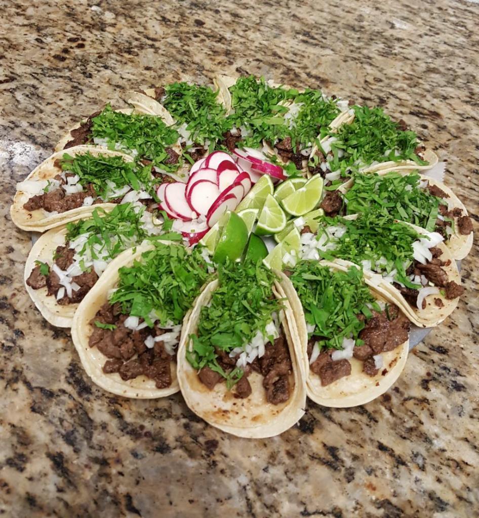 3 Tacos de Bistec · Steak. 3 soft shell tacos with onions, cilantro and side of sauce.