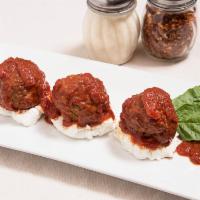 Meatball Platter · Homemade meatballs covered in traditional sauce served with spaghetti.