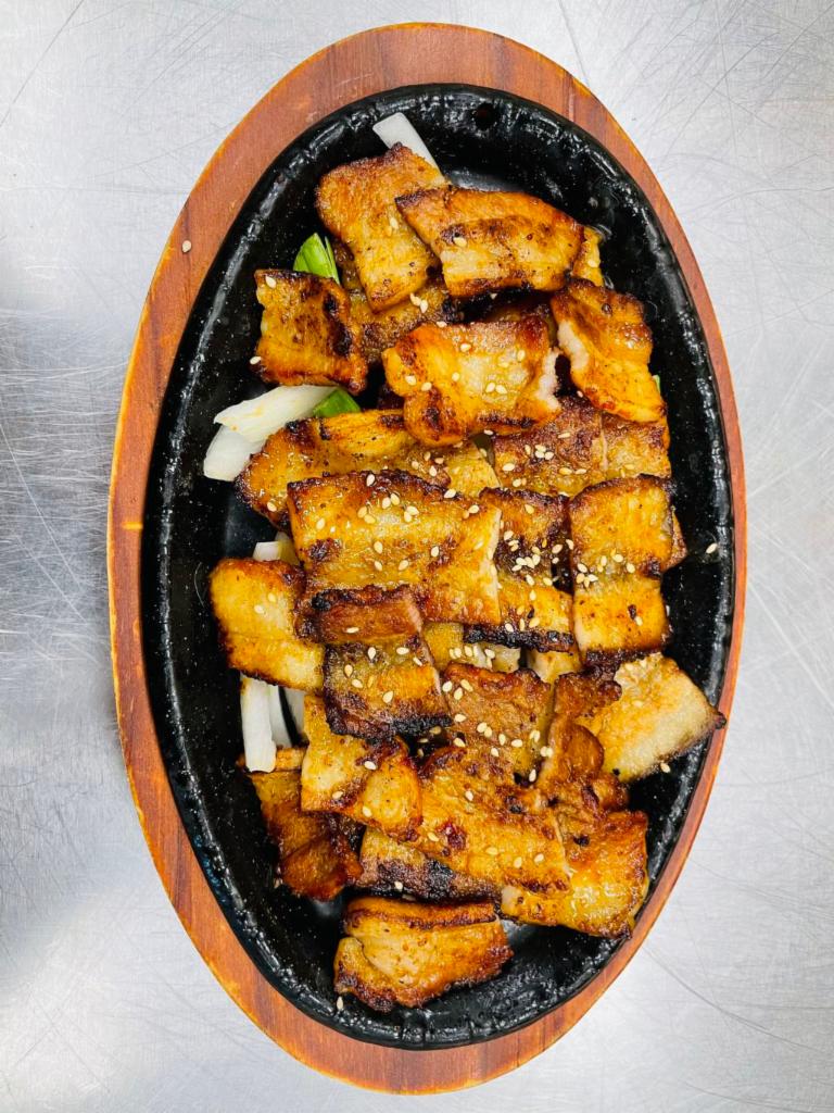 Spicy Pork Belly · Grilled pork belly marinated in spicy sauce.