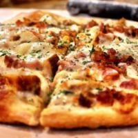Buffalo Chicken Pizza · Choice of ranch or blue cheese base, mozzarella cheese, fresh marinated chicken breast and o...