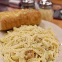 Fettuccine Chicken Alfredo · Fettuccine Pasta w/ creamy Alfredo Sauce, topped with Parmesan cheese. Served with a side of...
