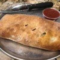 Cheese Stromboli · Includes a side of Marinara sauce