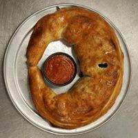 5 Meat Calzone · Ground beef, sausage, pepperoni, bacon, ham, ricotta, and mozzarella cheese. Includes a side...