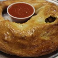 5 Cheese Calzone · Feta cheese, mozzarella, ricotta, provolone and Parmesan cheeses. Includes a side of Marinar...