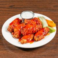 Buffalo Wings · Six pieces. Hot spicy chicken wings served with celery and carrots.